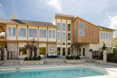 Inspiration for a contemporary stone exterior home remodel in Philadelphia