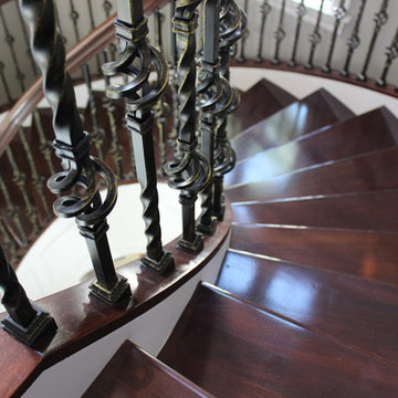 Walnut Circular Stair with Twist & Basket Iron Balusters
