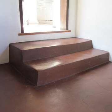 Natural mud floor and steps at historic adobe house