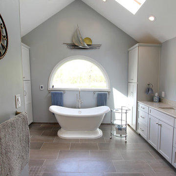 Gray Vanity with Freestanding Tub and Tiled Walkin Shower