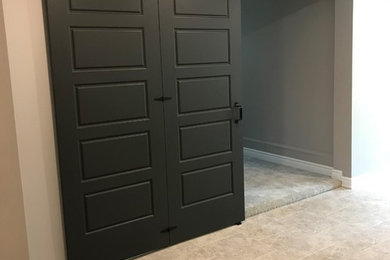 Inspiration for a small transitional carpeted and gray floor home office remodel in Toronto with gray walls
