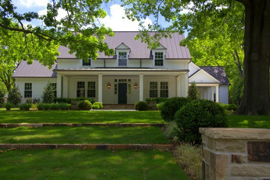 This is an example of a large traditional two-storey white exterior in Dallas with concrete fiberboard siding.