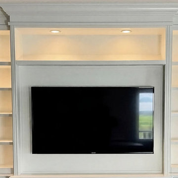 Custom Built-In Media Wall with Glass Display Cabinets