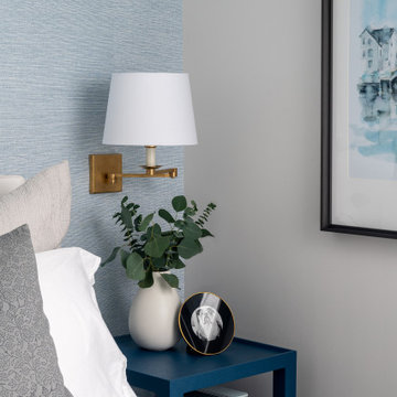 Coastal Inspired Guest Bedroom With Blue Grasscloth Wallpaper And Bedside Sconce
