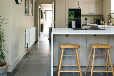 Photo of a scandinavian kitchen in Other with limestone flooring and grey floors.