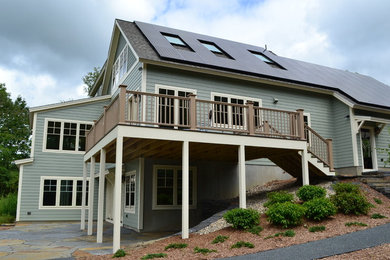 Mid-sized traditional gray two-story wood exterior home idea in Boston with a shingle roof