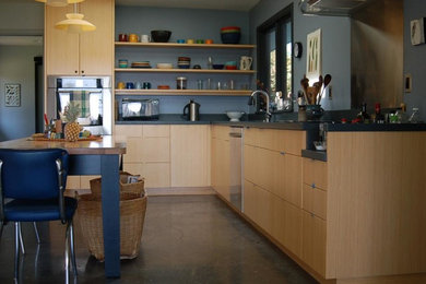 Large l-shaped eat-in kitchen photo in Portland with a double-bowl sink, flat-panel cabinets, medium tone wood cabinets, wood countertops, stainless steel appliances and an island