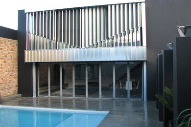 Example of a trendy exterior home design in Auckland