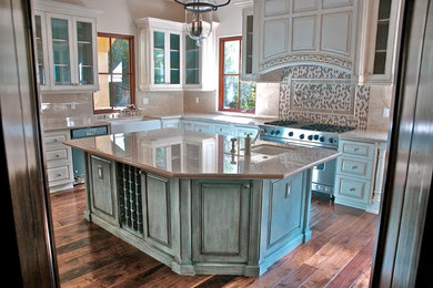 Large mediterranean galley open plan kitchen in Los Angeles with raised-panel cabinets, blue cabinets, quartz benchtops, multi-coloured splashback and with island.