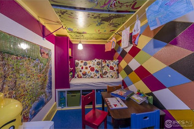 Kids' room - small eclectic girl blue floor kids' room idea in Denver with multicolored walls