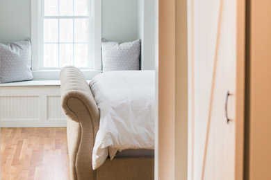 Example of a transitional bedroom design in Boston