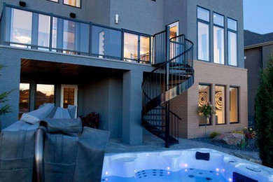 Inspiration for a mid-sized modern backyard deck remodel in Other with no cover