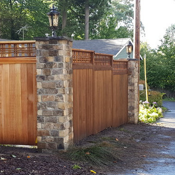 Cedar fence with stone columns and electric lanterns - before and after pictures