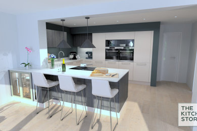 Große Moderne Küche in L-Form mit weißen Schränken, Quarzit-Arbeitsplatte, schwarzen Elektrogeräten, Kücheninsel und weißer Arbeitsplatte in Sussex
