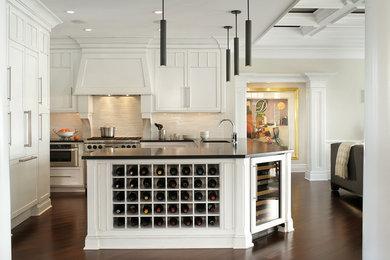 Example of a classic open concept kitchen design in Other with recessed-panel cabinets, white cabinets, beige backsplash and paneled appliances