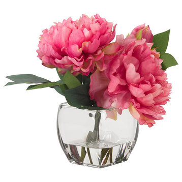 Pink peonies in glass cube