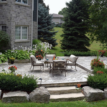 A stone deck built on steel substructure and a covered porch deck in Veka vinyl.