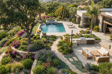 Inspiration for a large mediterranean backyard stone and rectangular pool remodel in Los Angeles with a bbq area