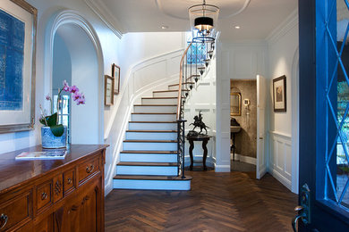 Single front door - traditional dark wood floor single front door idea in Phoenix with white walls