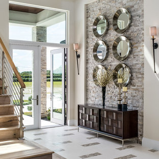 На фото: с высоким бюджетом большие фойе в стиле современная классика с бежевыми стенами, двустворчатой входной дверью, стеклянной входной дверью, белым полом и полом из керамогранита