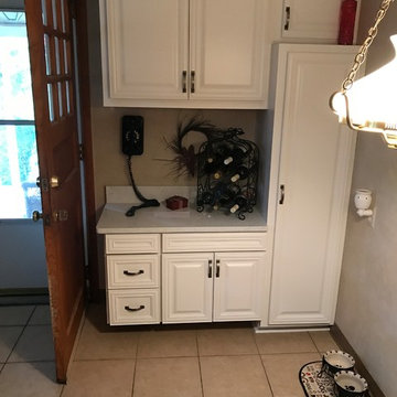 cabinet refacing--white with quartz countertops and glass backsplash