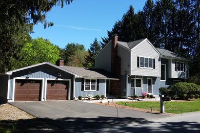 Transitional attached two-car garage photo in Boston