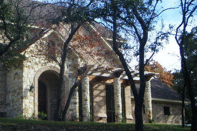 Photo of a traditional home design in Austin.