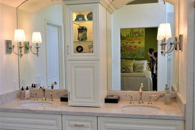 Inspiration for a mid-sized traditional master bathroom in San Francisco with beaded inset cabinets, white cabinets, a curbless shower, a one-piece toilet, white tile, porcelain tile, porcelain floors, an undermount sink, granite benchtops, white floor, an open shower, white benchtops, beige walls, a double vanity and a built-in vanity.