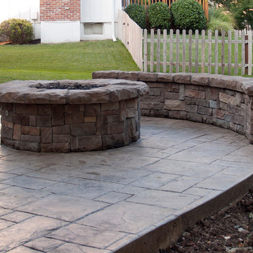 Leeder - Cedar deck in Kansas City with stamped concrete patio and firepit.