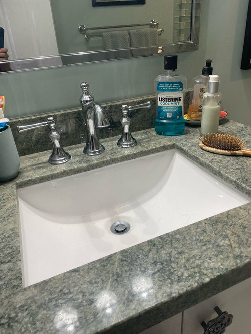 Tiling over versus tearing down existing shower tile