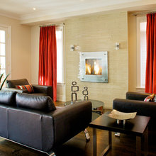 living rooms with black couches