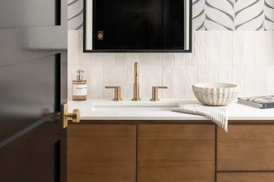 Example of a minimalist terrazzo floor, double-sink and wallpaper bathroom design in Milwaukee with flat-panel cabinets, medium tone wood cabinets and a freestanding vanity