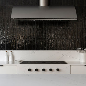 White Kitchen with Dramatic Glossy Black Tile Backsplash