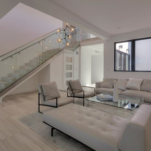 This is an example of a medium sized modern concrete straight glass railing staircase in Miami with concrete risers.