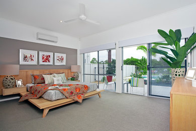 Example of a mid-sized asian master carpeted bedroom design in Detroit with multicolored walls and no fireplace