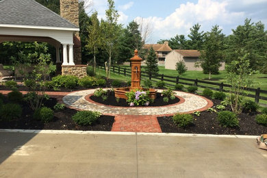Large mountain style backyard concrete paver patio photo in Columbus with a fire pit and a gazebo