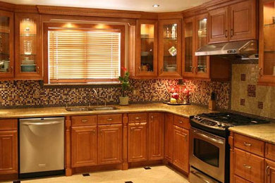 Open concept kitchen - large traditional u-shaped travertine floor open concept kitchen idea in Detroit with a double-bowl sink, raised-panel cabinets, medium tone wood cabinets, granite countertops, beige backsplash, stone tile backsplash, stainless steel appliances and an island