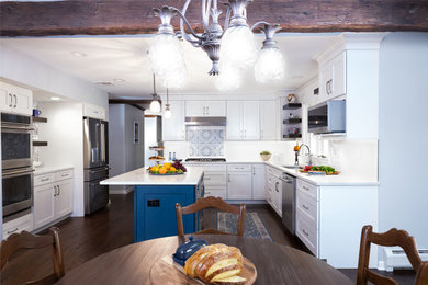 Eat-in kitchen - traditional dark wood floor and brown floor eat-in kitchen idea in New York with an undermount sink, shaker cabinets, white cabinets, quartzite countertops, blue backsplash, ceramic backsplash, stainless steel appliances, an island and white countertops