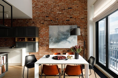 Photo of an urban open plan dining room in Moscow with brown walls, light hardwood flooring, beige floors and feature lighting.