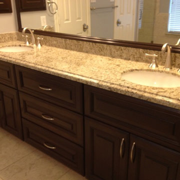 Rebuilt Bathroom with Walnut Stain Cabinets