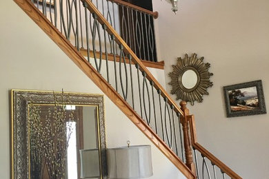 Large transitional entryway photo in Minneapolis with beige walls