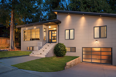 Large transitional beige house exterior in Vancouver.