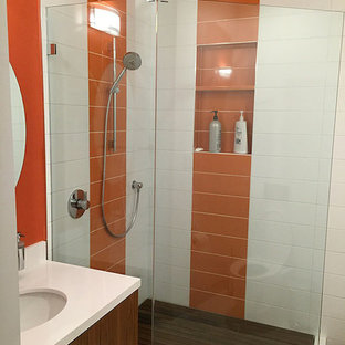 Example of a mid-sized minimalist master plywood floor corner shower design in San Francisco with flat-panel cabinets, medium tone wood cabinets, multicolored walls and an undermount sink