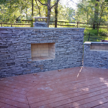 STONE FIREPLACE  , BBQ GRILL   AND STONE RETAINING WALL