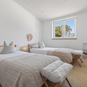 Twin Bedroom with Layered Textiles and Garden Window