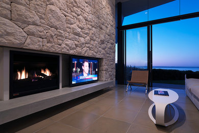 This is an example of a large contemporary open concept living room in Melbourne with a wall-mounted tv.