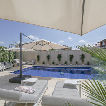 A Stunning Poolside With Artificial Green Walls and Plants