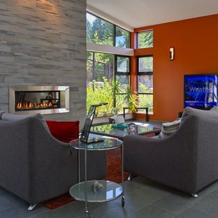 Medium sized contemporary home cinema in Vancouver with multi-coloured walls, slate flooring and a wall mounted tv.