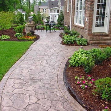 Concrete Walkways Beside Brick Home