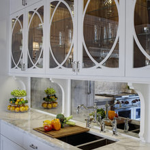mirror backsplash and upper cabinets